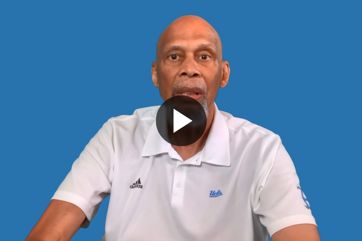 UCLA mathematician and Fields Medal winner Terence Tao smiling near a chalkboard